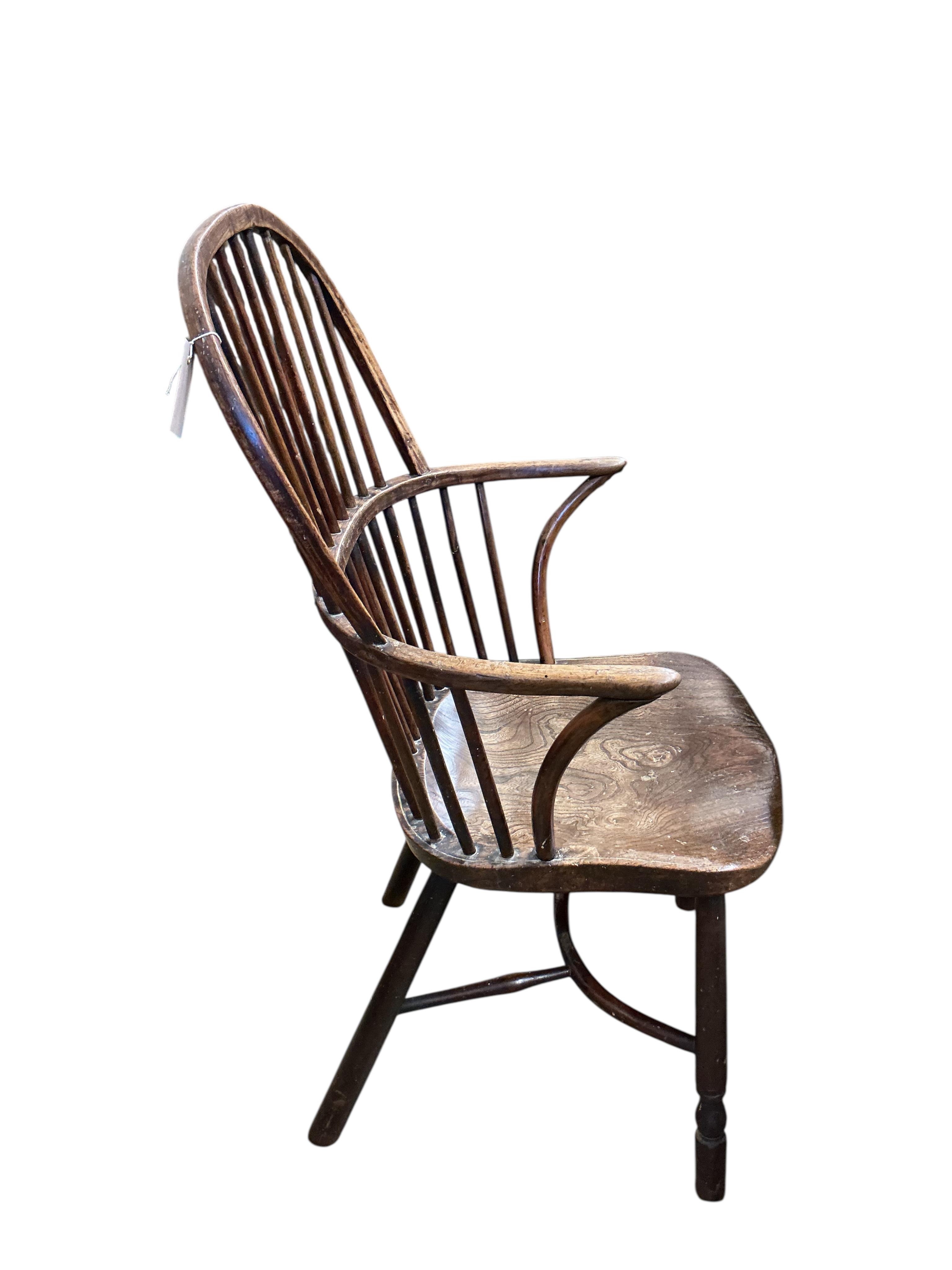 A 19th century ash, elm and beech Windsor comb back with crinoline stretcher armchair, width 57cm, depth 43cm, height 102cm